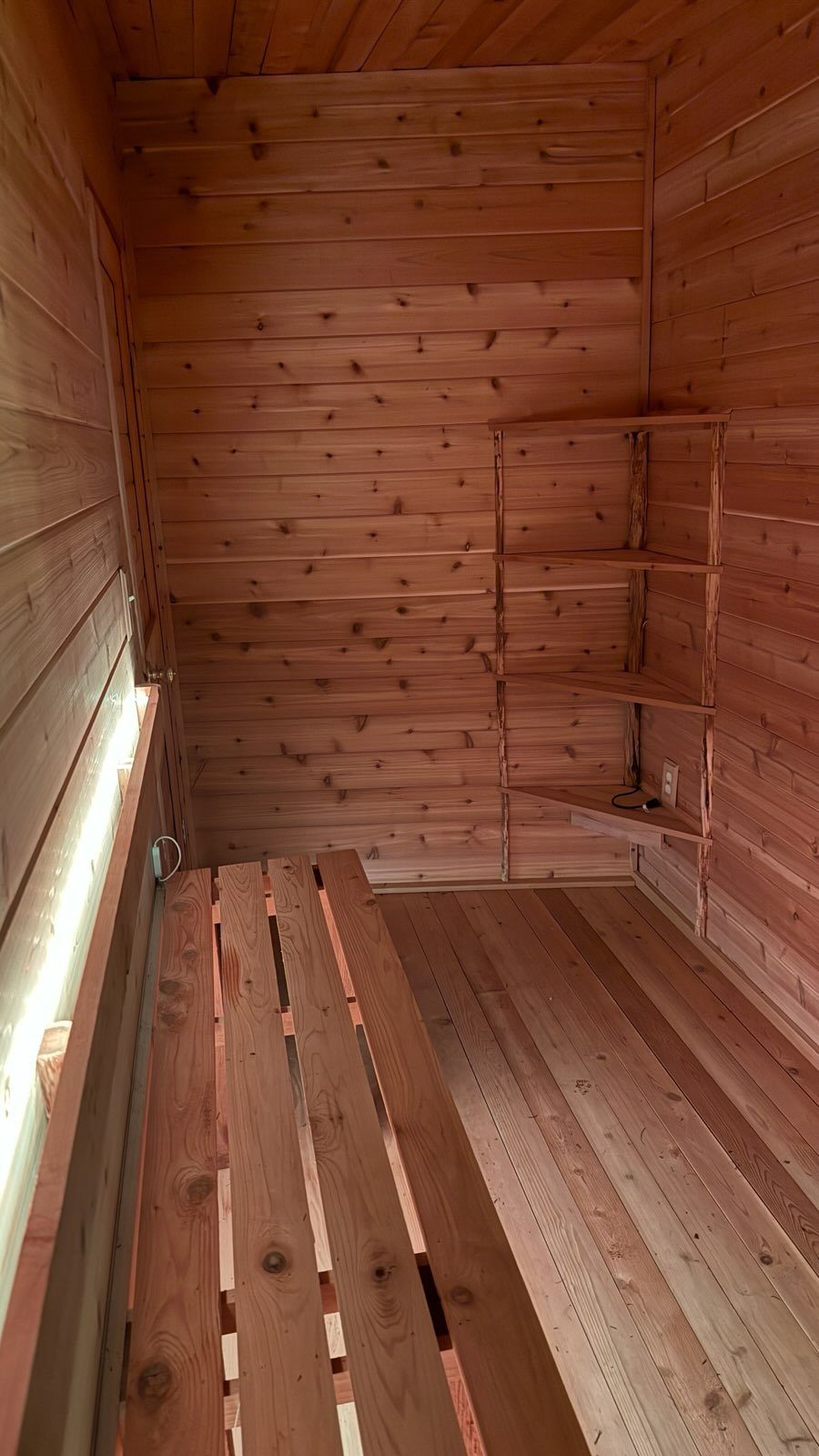 Tiered cedar benches inside the sauna
