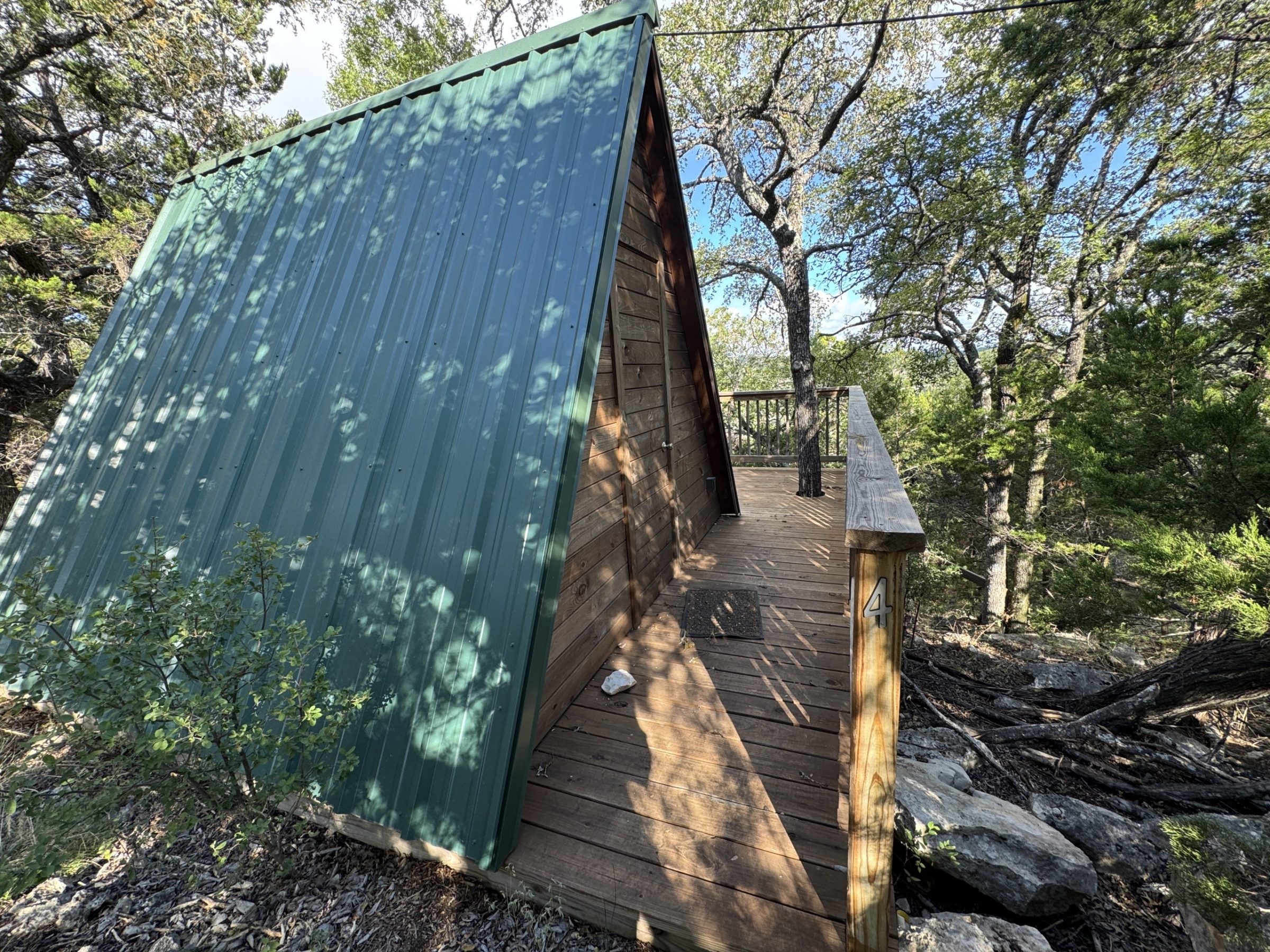 An A-frame glamping cabin tucked into the trees