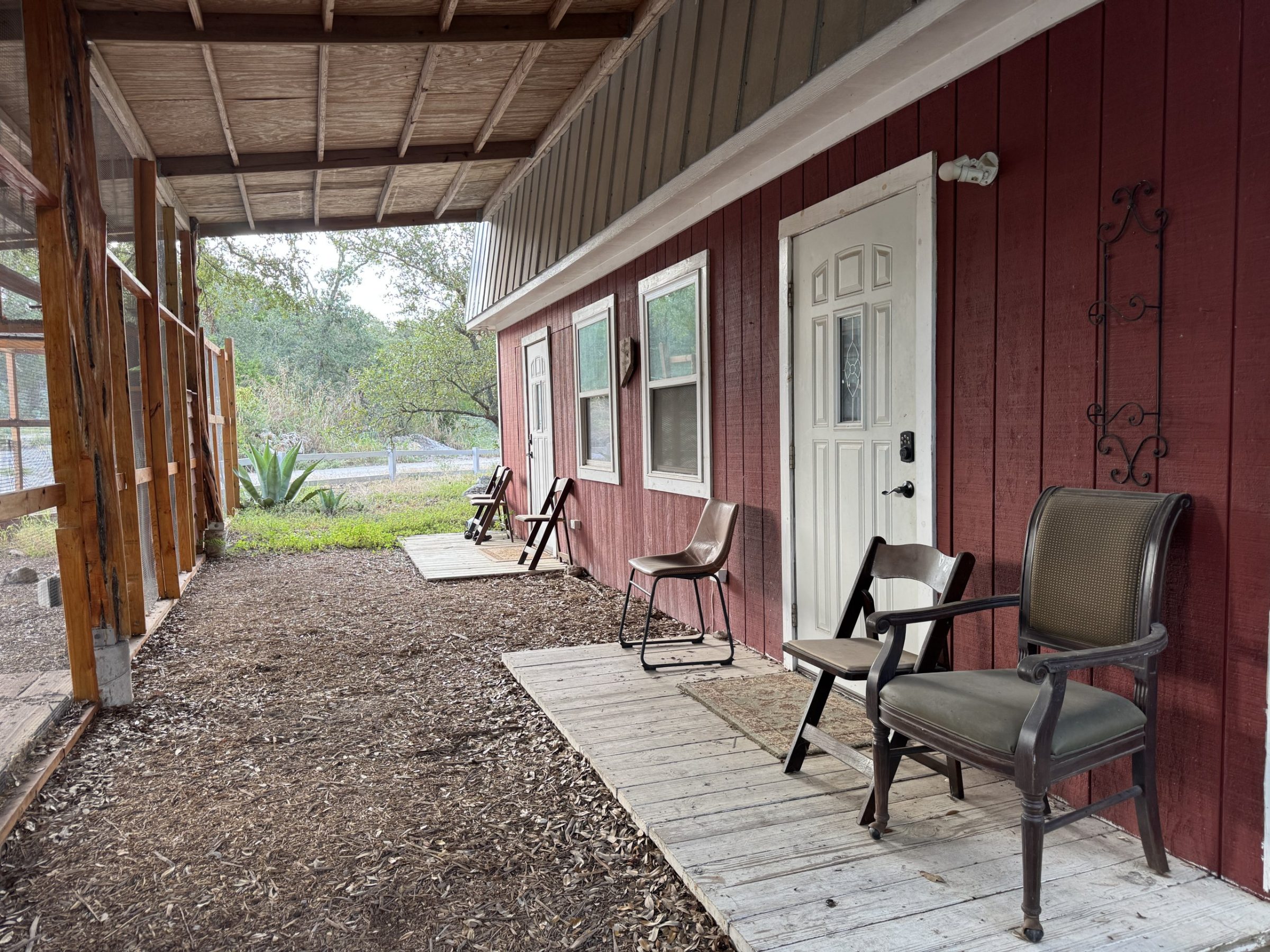 The covered porch of the Barn with rocking chairs